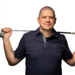 Michael Howlett posing with his golf club