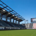 View of Audi Field stands, field, and scoreboard from the pitch